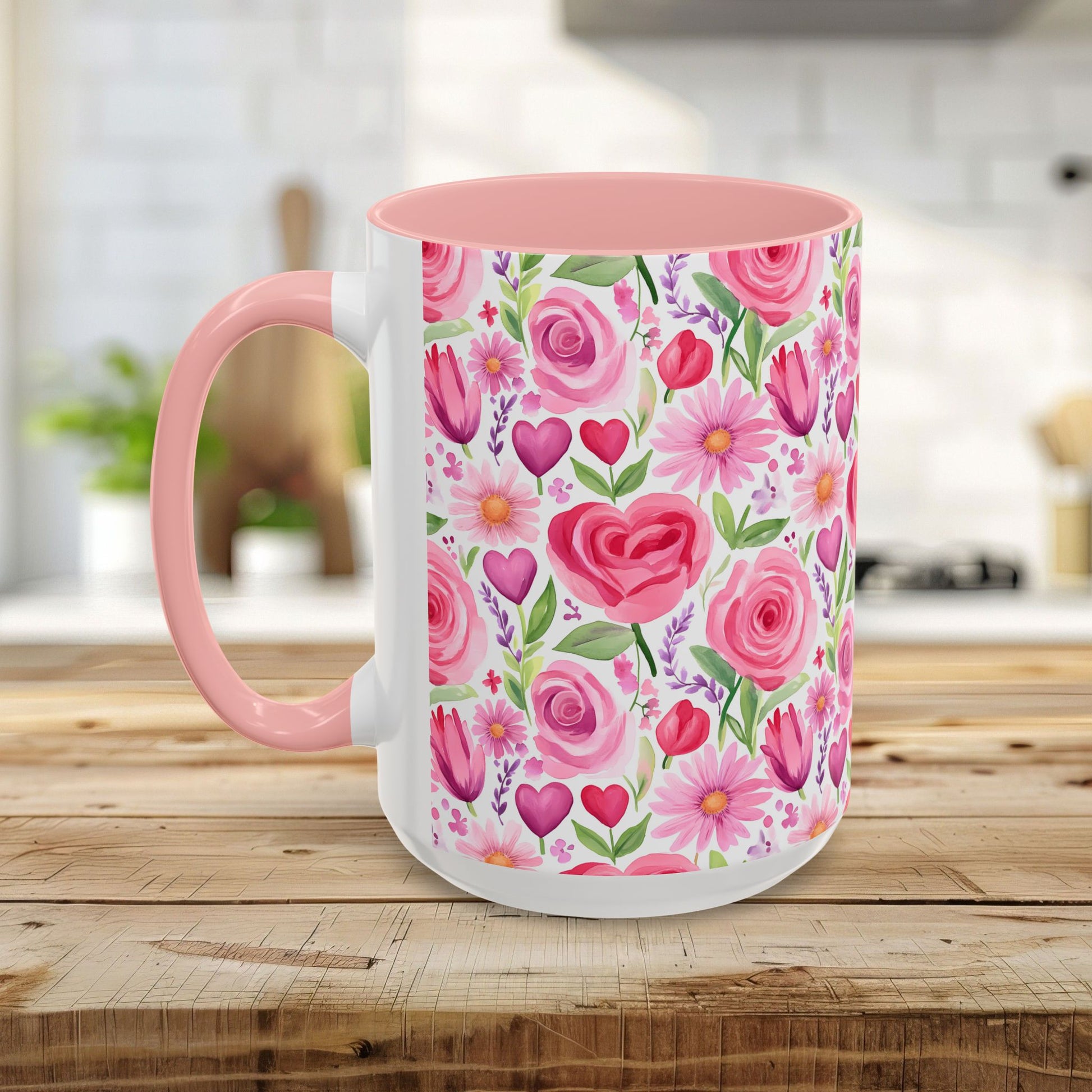 White ceramic mug with pink rose, tulip, daisy, and heart watercolor print, pink interior, and C-shaped handle.