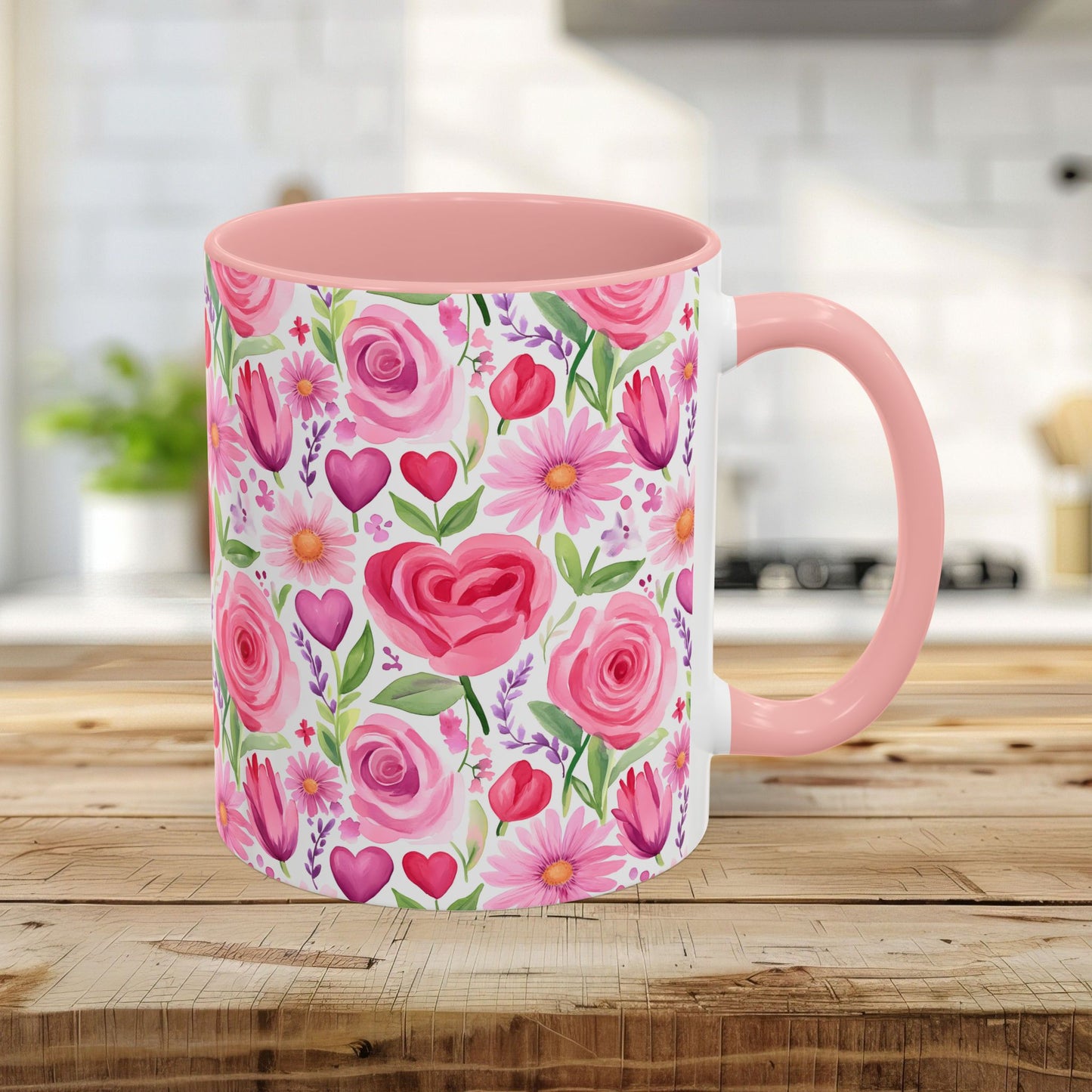 Pink 11oz ceramic mug with watercolor roses, tulips, daisies, and hearts on a white background.