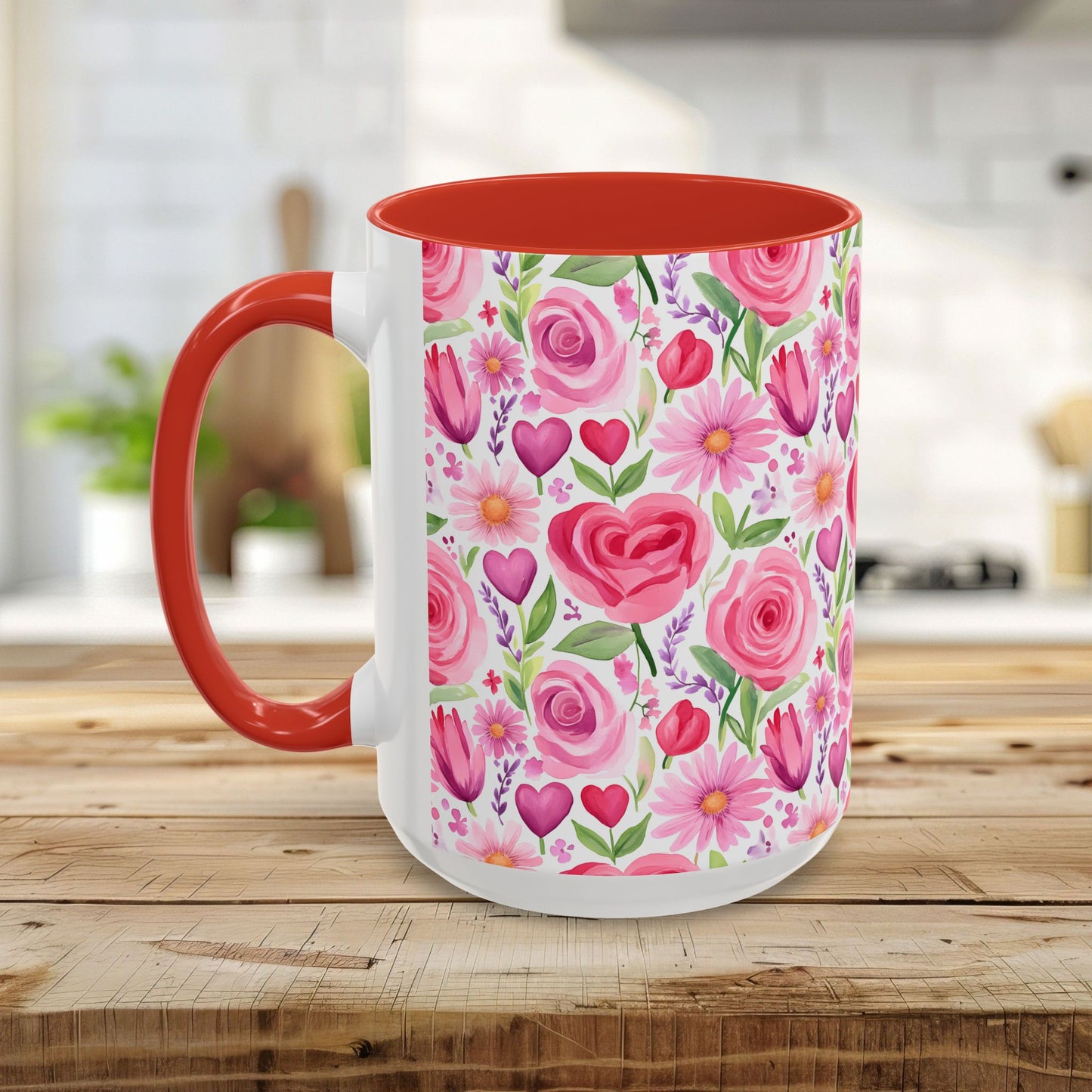 White ceramic mug with a pink rose, tulip, daisy, and heart floral pattern, red handle, and red interior.