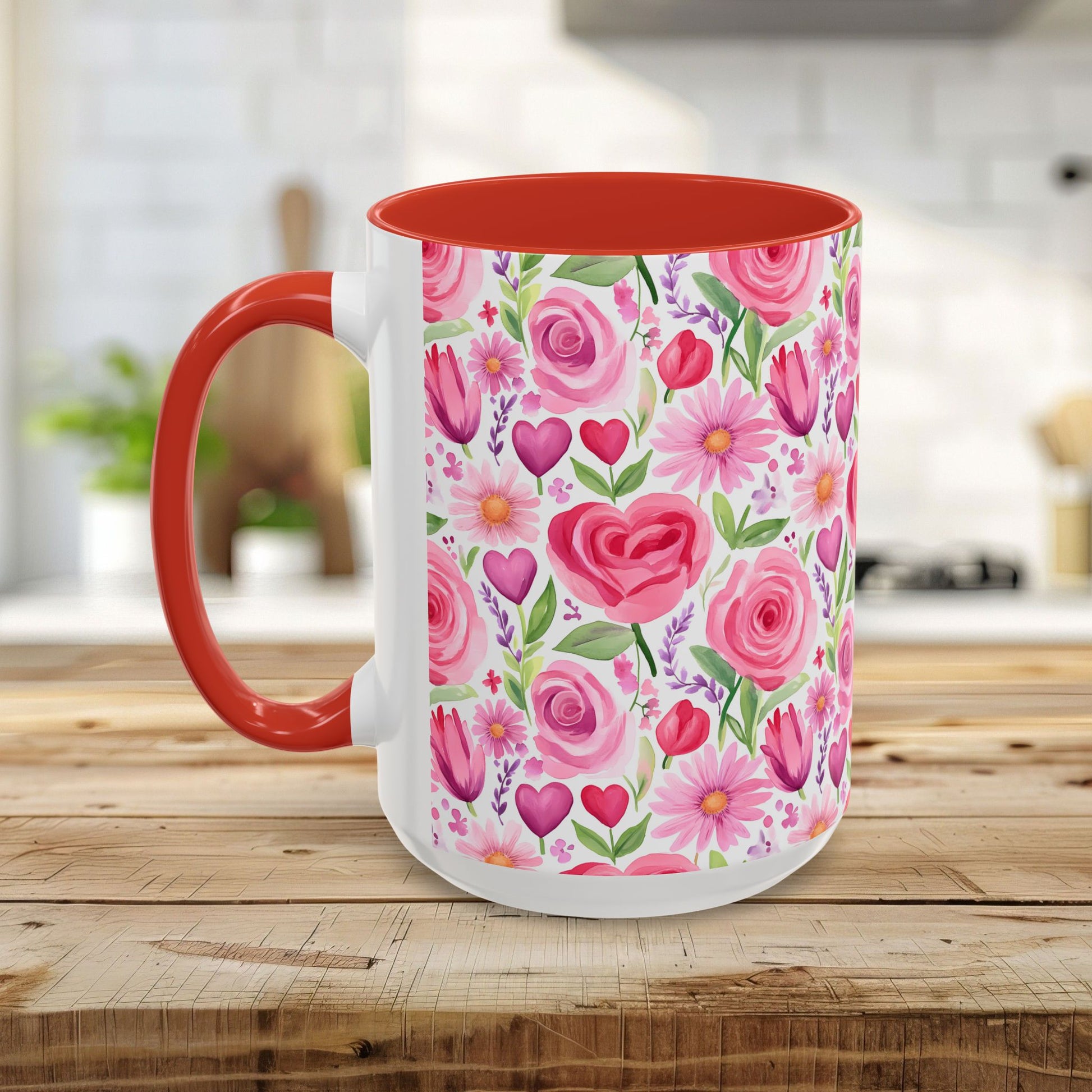 White ceramic mug with a pink rose, tulip, daisy, and heart floral pattern, red handle, and red interior.