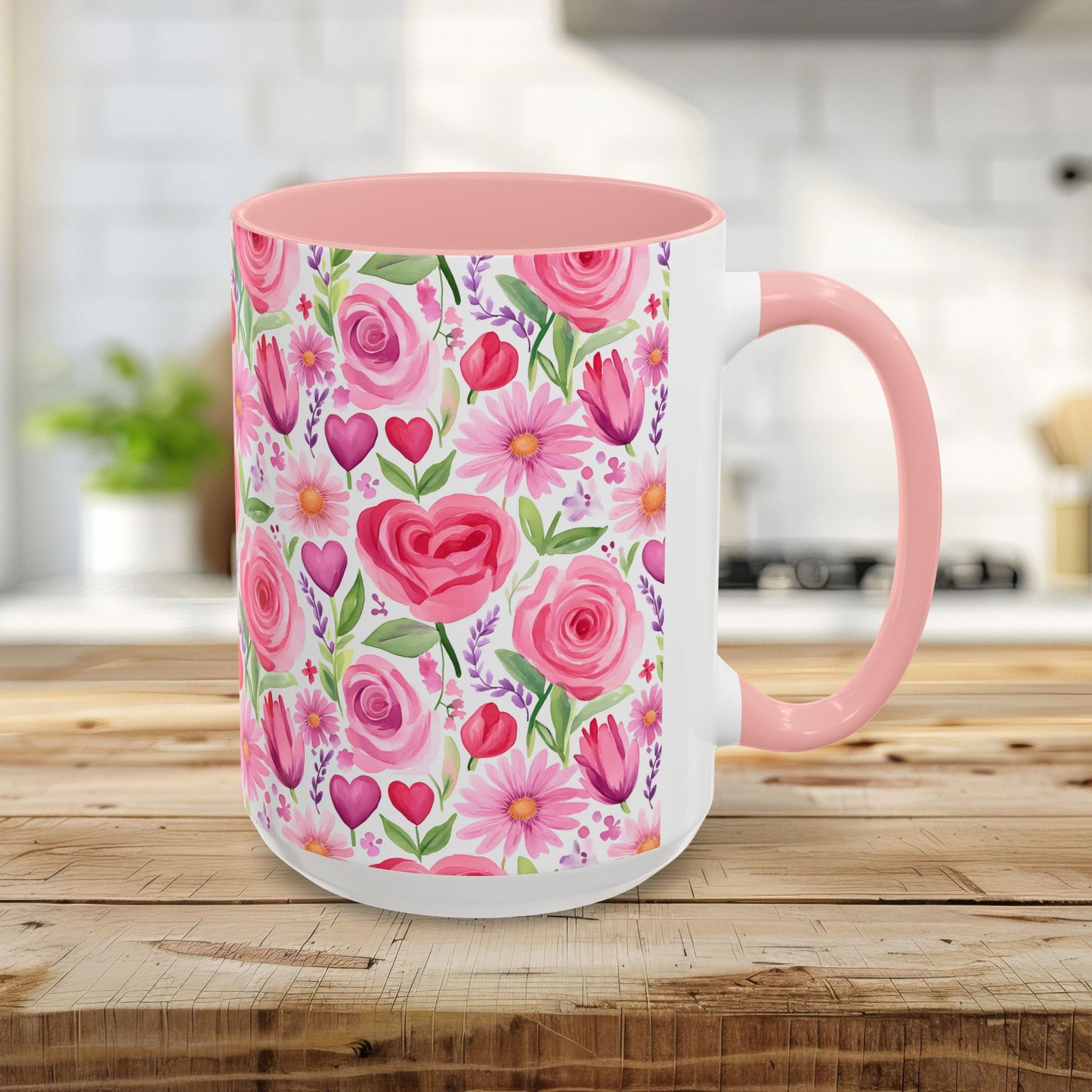 15oz ceramic mug with pink interior, handle, and a watercolor print of pink roses, tulips, daisies, and hearts.