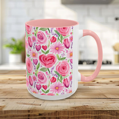 15oz ceramic mug with pink interior, handle, and a watercolor print of pink roses, tulips, daisies, and hearts.