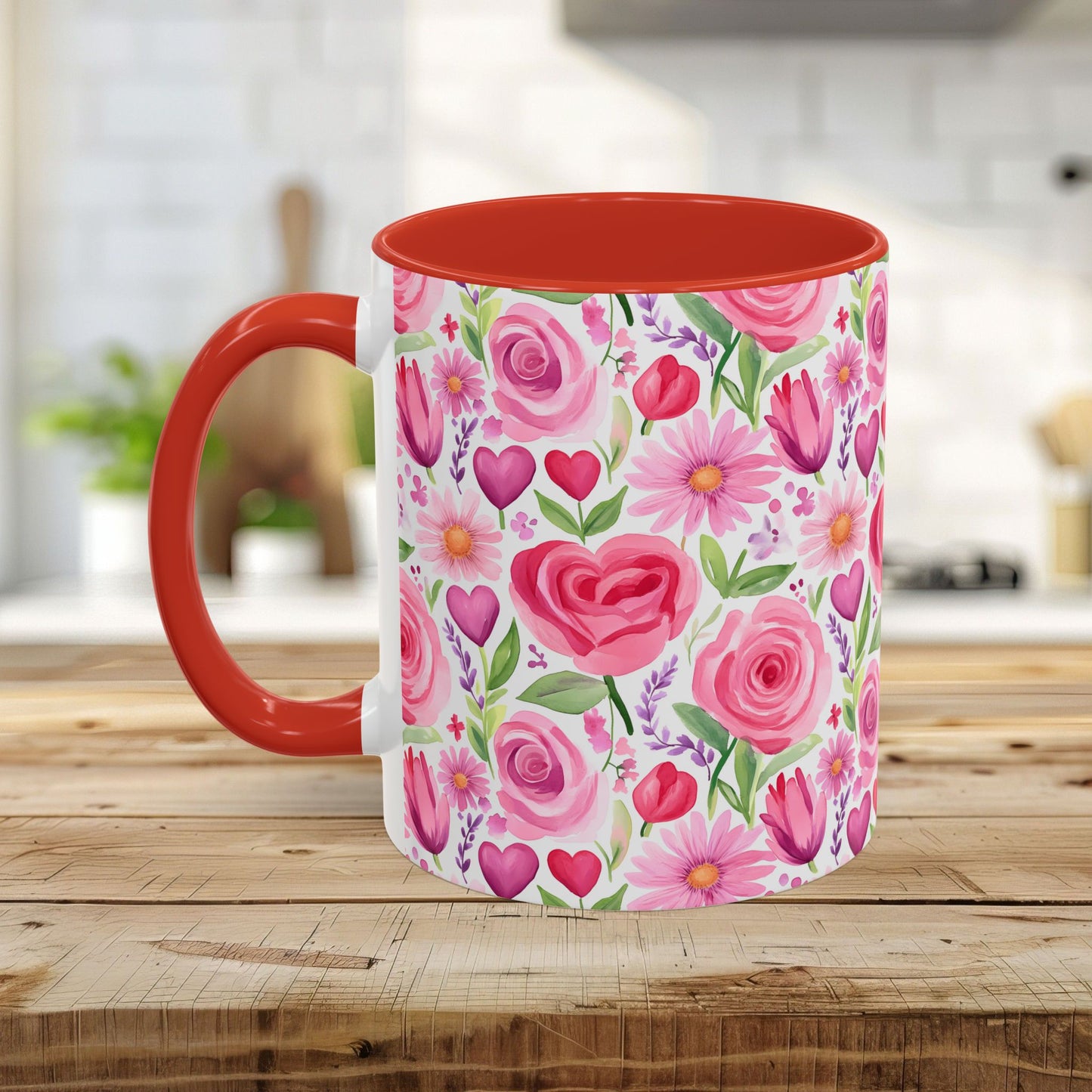 White ceramic mug with a red handle and interior, featuring a watercolor print of pink roses, tulips, daisies, and hearts.