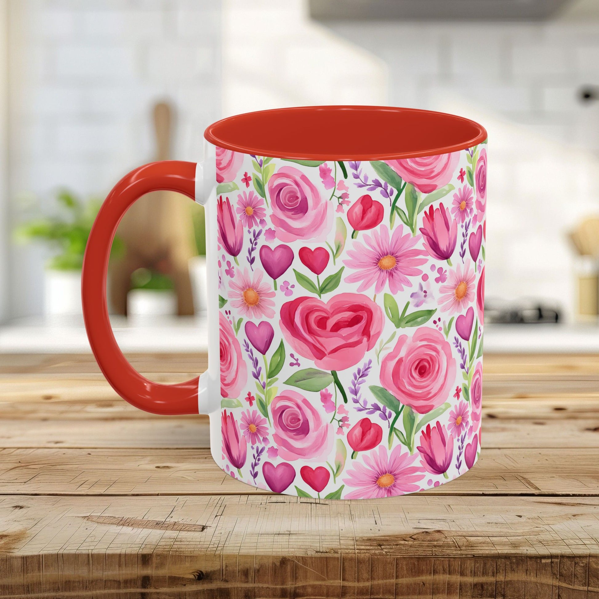 White ceramic mug with a red handle and interior, featuring a watercolor print of pink roses, tulips, daisies, and hearts.
