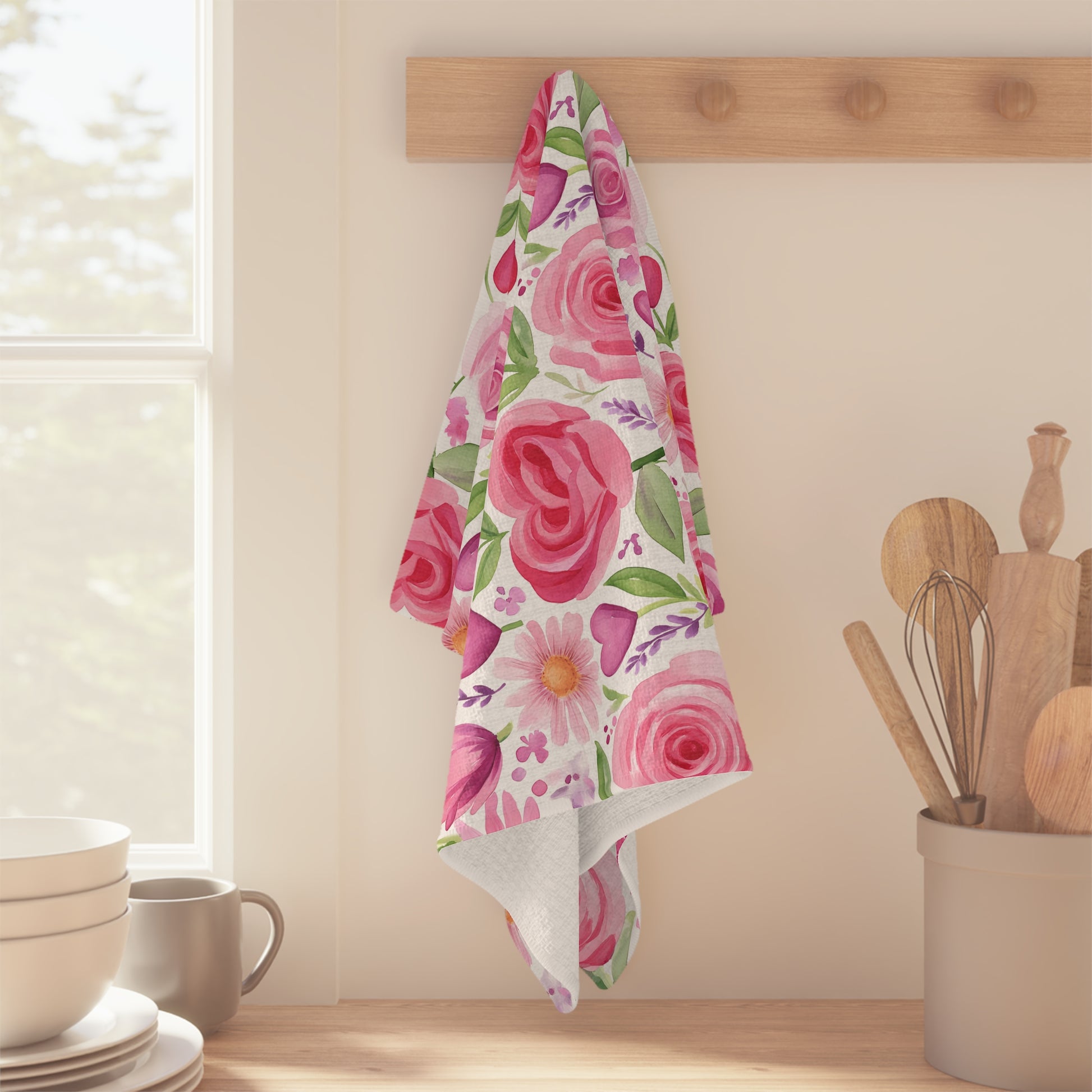 Pink rose & tulip heart microfiber kitchen towel with watercolor floral print, hanging on a wooden hook.