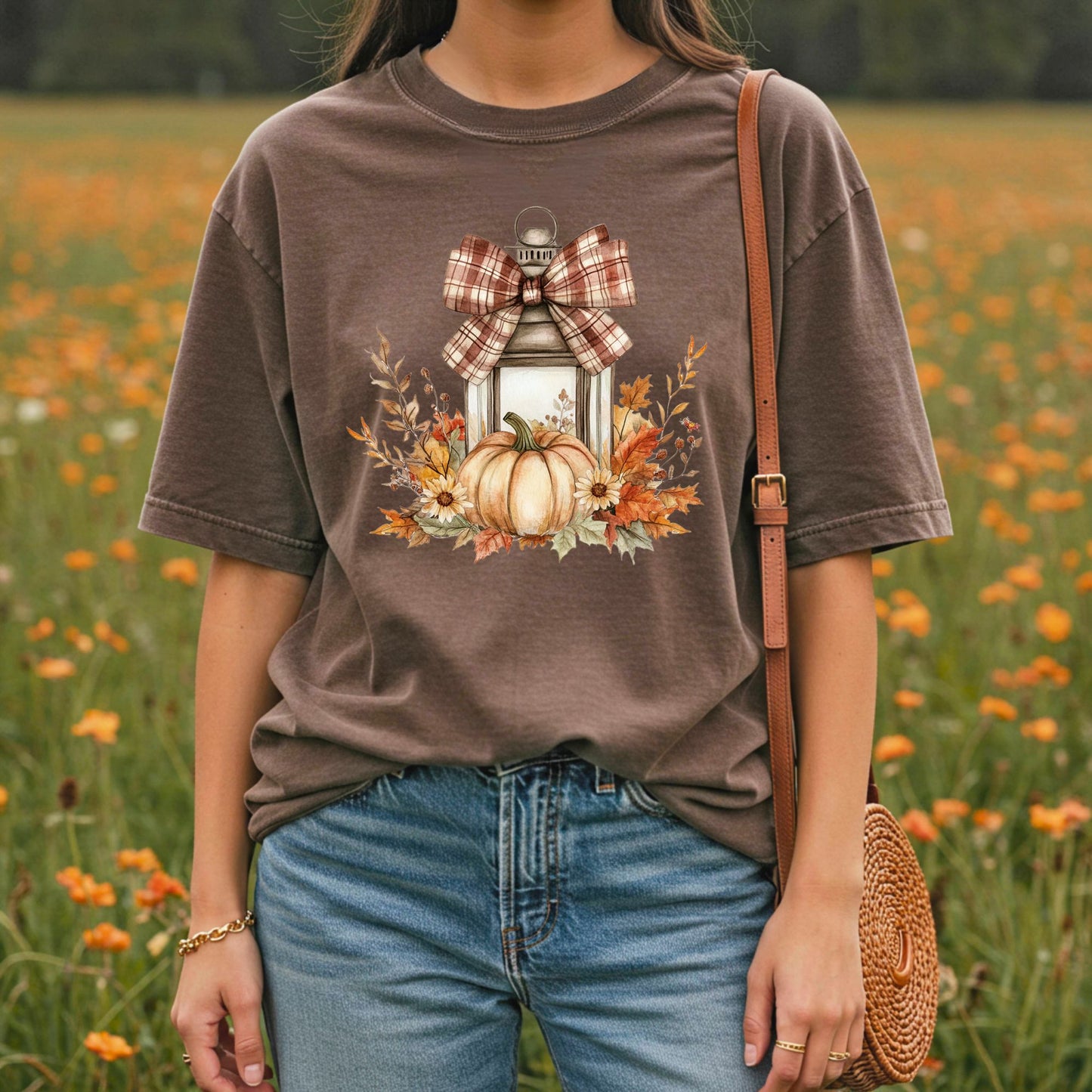 Garment-dyed brown tee with a rustic lantern, pumpkin, sunflowers, and plaid bow design.