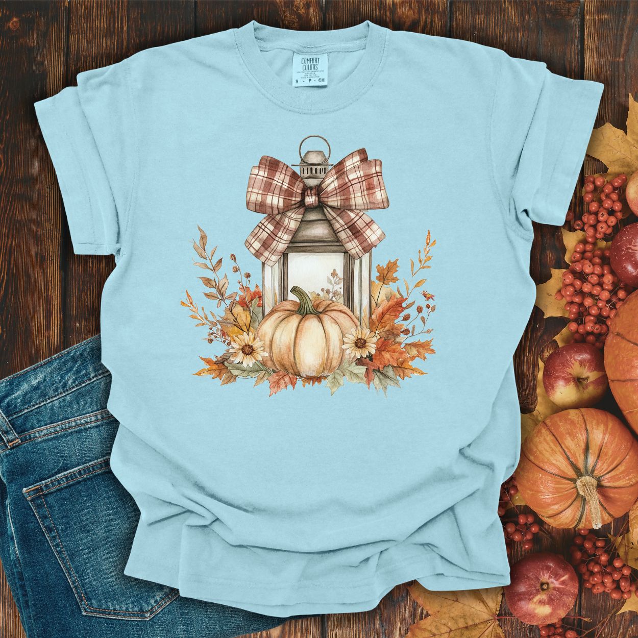 Chambray garment-dyed tee with a rustic autumn lantern, pumpkin, sunflowers, and plaid bow design.
