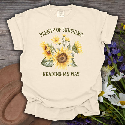 Ivory garment-dyed t-shirt with "Plenty of Sunshine Heading My Way" and sunflower graphic.