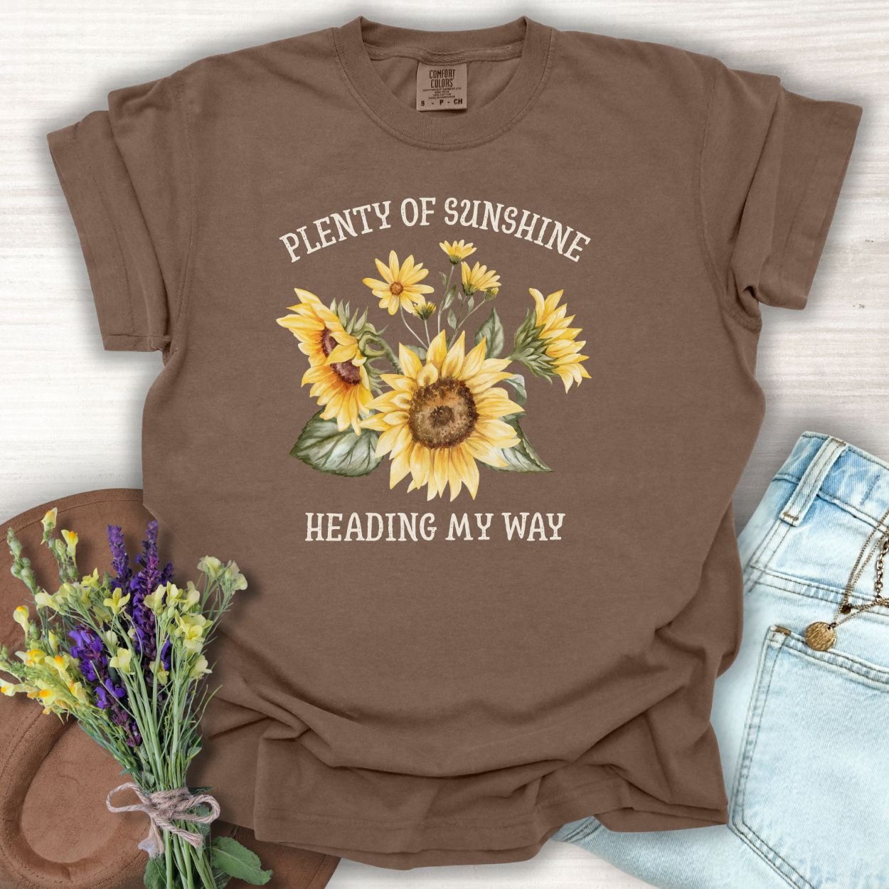Espresso S-size t-shirt with "Plenty of Sunshine Heading My Way" text and sunflower graphic.