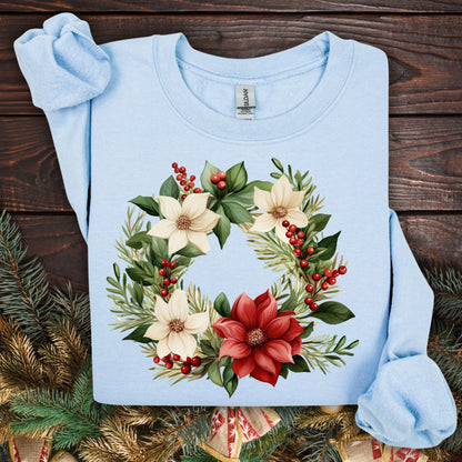 Light blue Gildan crewneck sweatshirt (S) with a watercolor poinsettia wreath design featuring red, cream, and green.