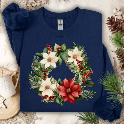 Navy Gildan crewneck sweatshirt with a watercolor poinsettia wreath design in red, white, and green.