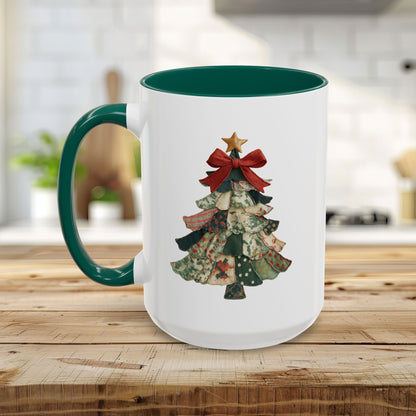 White ceramic mug with green handle and interior, featuring a patchwork Christmas tree design.