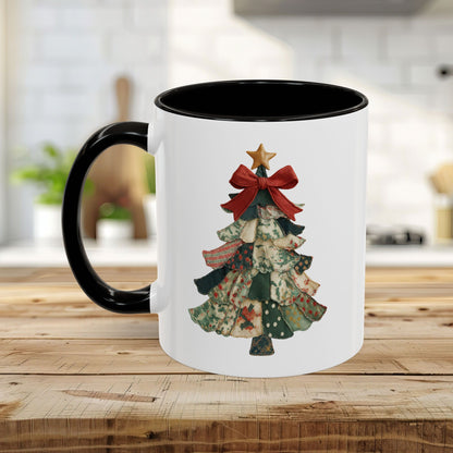 White ceramic mug with black handle and interior, featuring a preppy patchwork Christmas tree design.