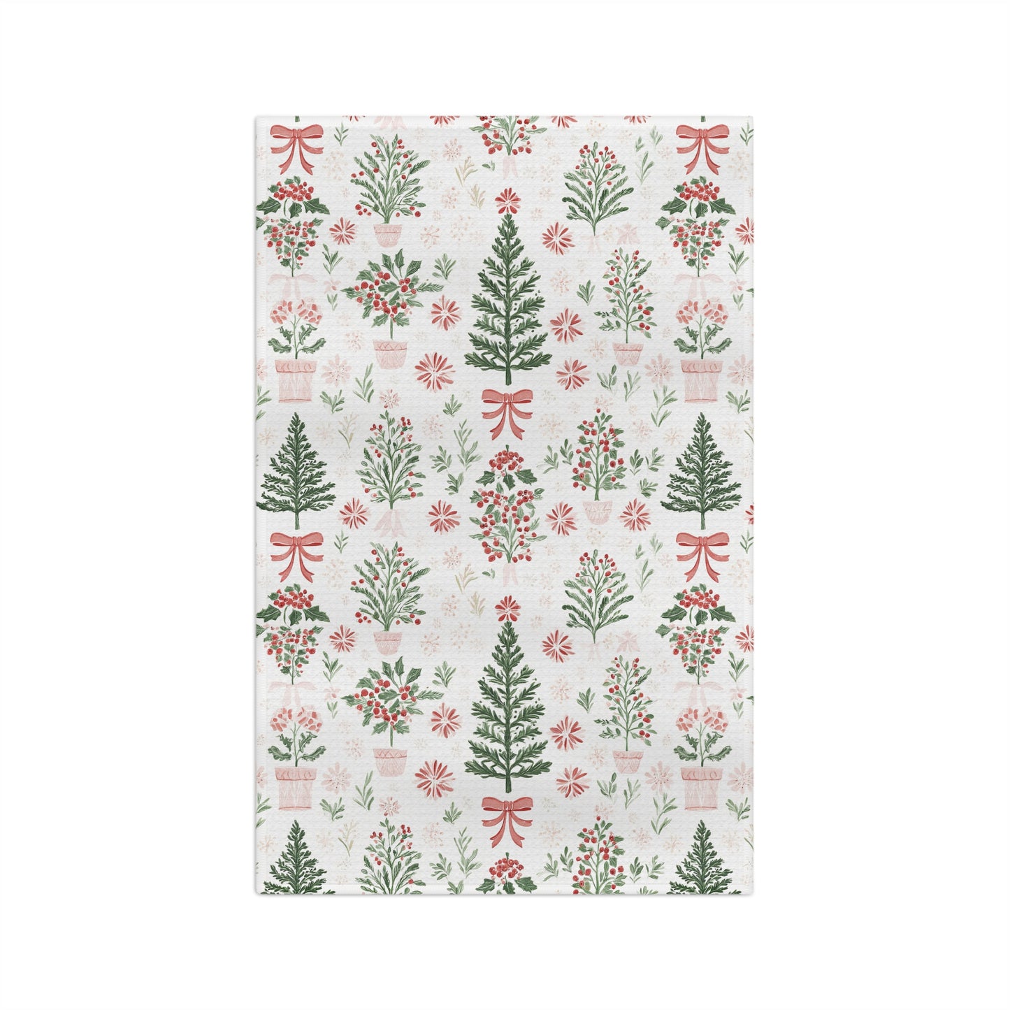 Microfiber tea towel with vintage-inspired Christmas trees, holly, and red bows on a light background.