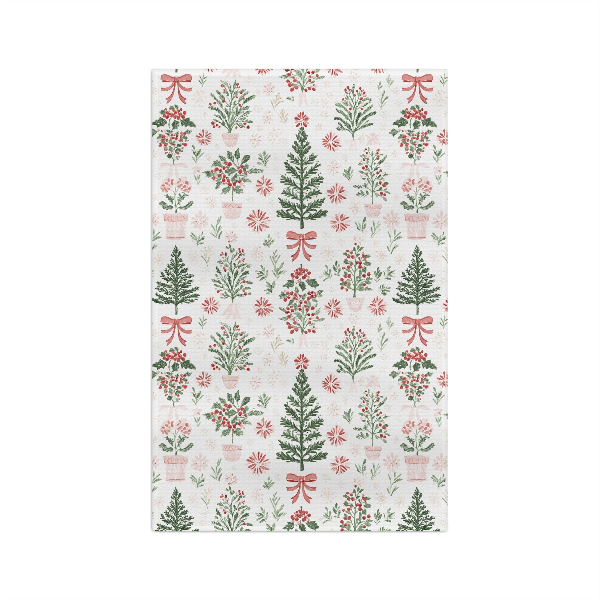Microfiber tea towel with vintage-inspired Christmas trees, holly, and red bows on a light background.