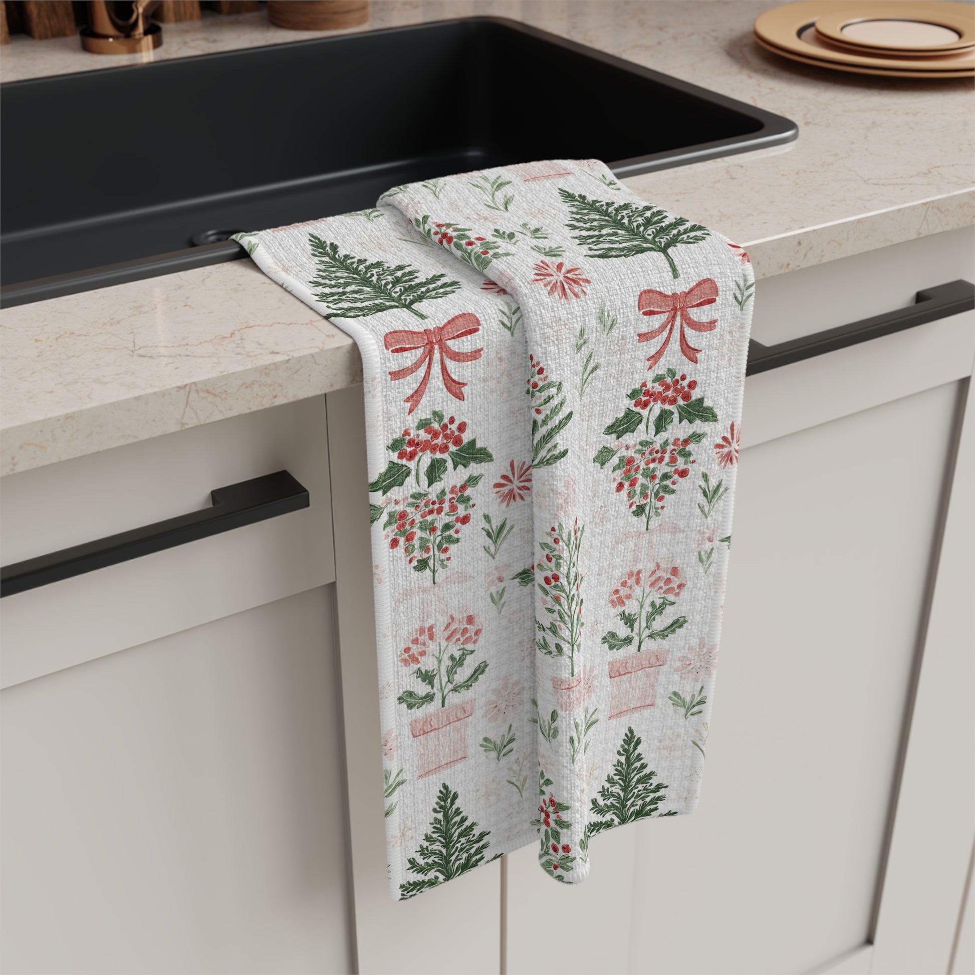 Microfiber tea towel with vintage-inspired Christmas tree, holly, and red ribbon botanical pattern.