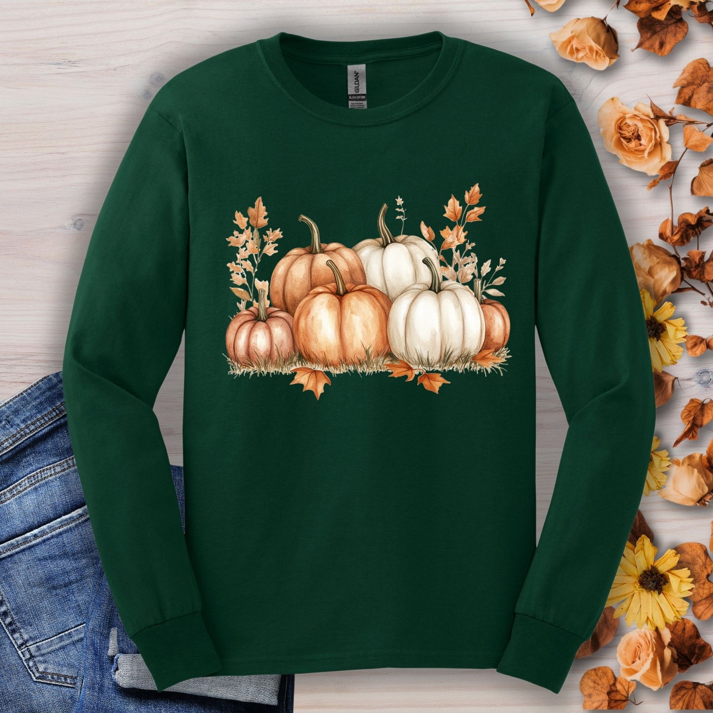 Forest Green long sleeve tee with watercolor orange and white pumpkins, 100% cotton, unisex fit.