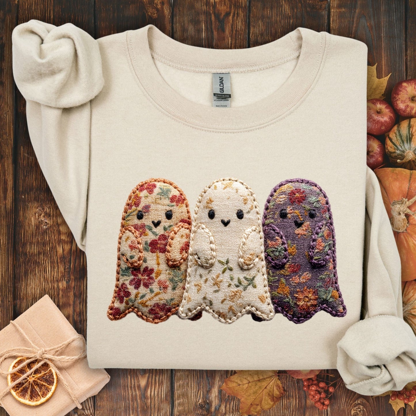 Sand Gildan sweatshirt with three embroidered-style ghosts made from vintage floral fabrics.
