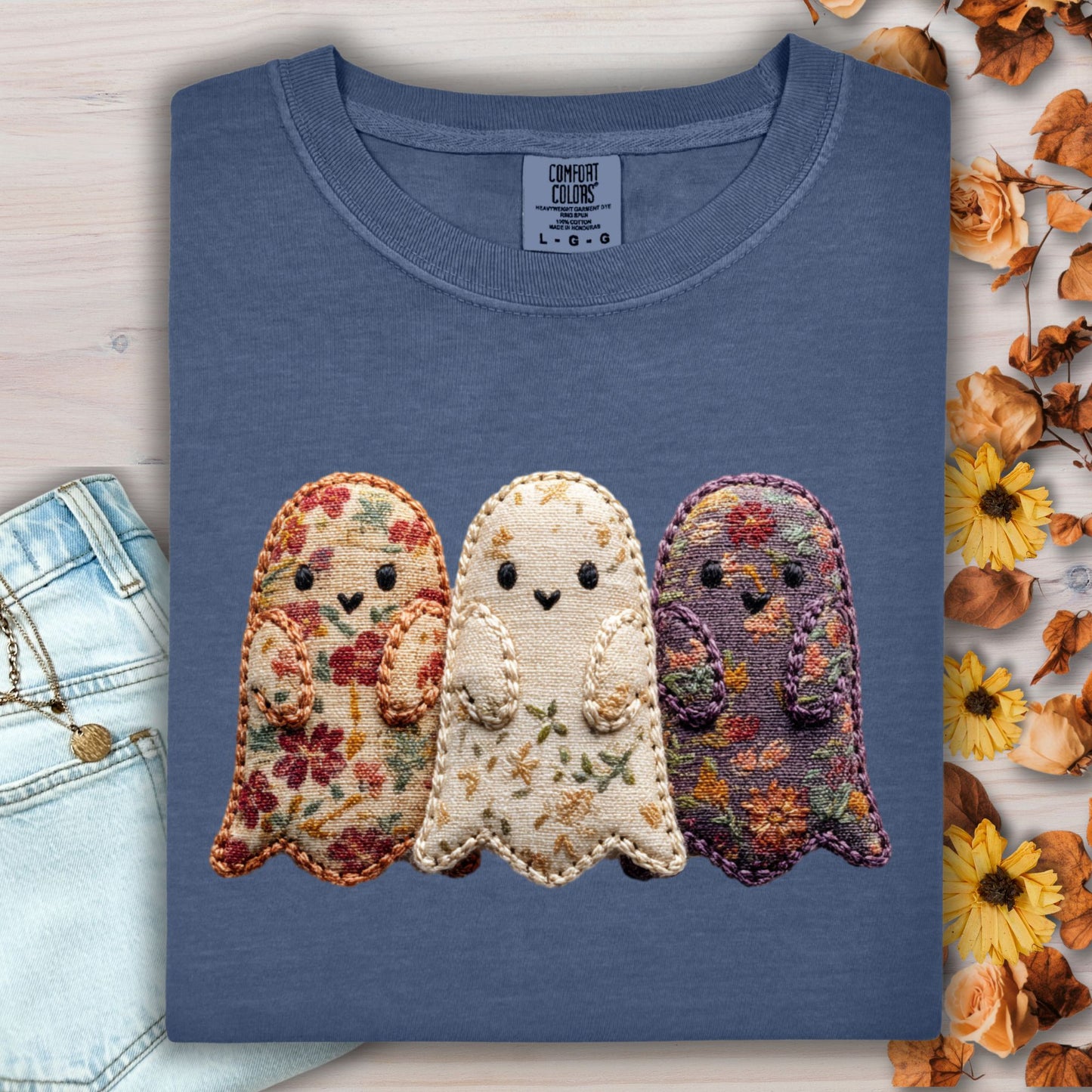 Denim Comfort Colors t-shirt with three embroidered floral fabric ghosts, shown with jeans and fall leaves.