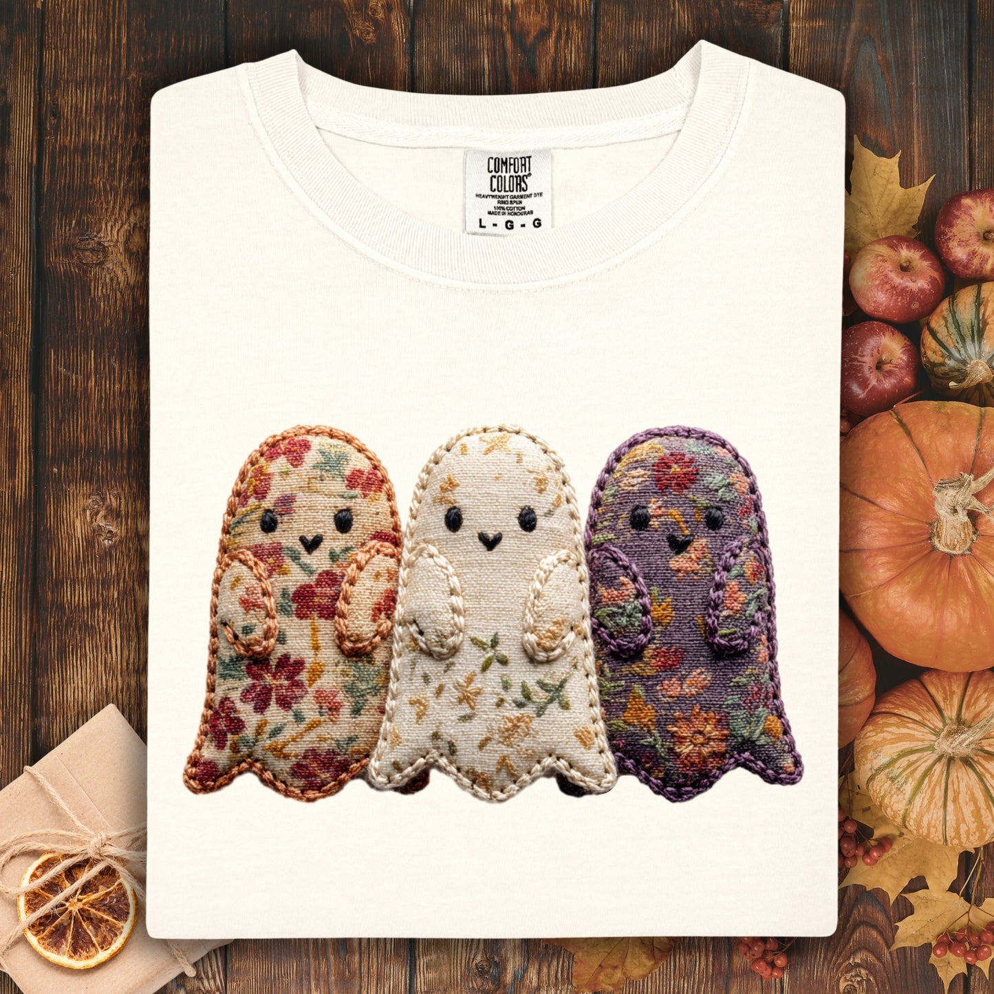 Ivory Comfort Colors t-shirt with three embroidered-style ghosts made from vintage floral fabrics.
