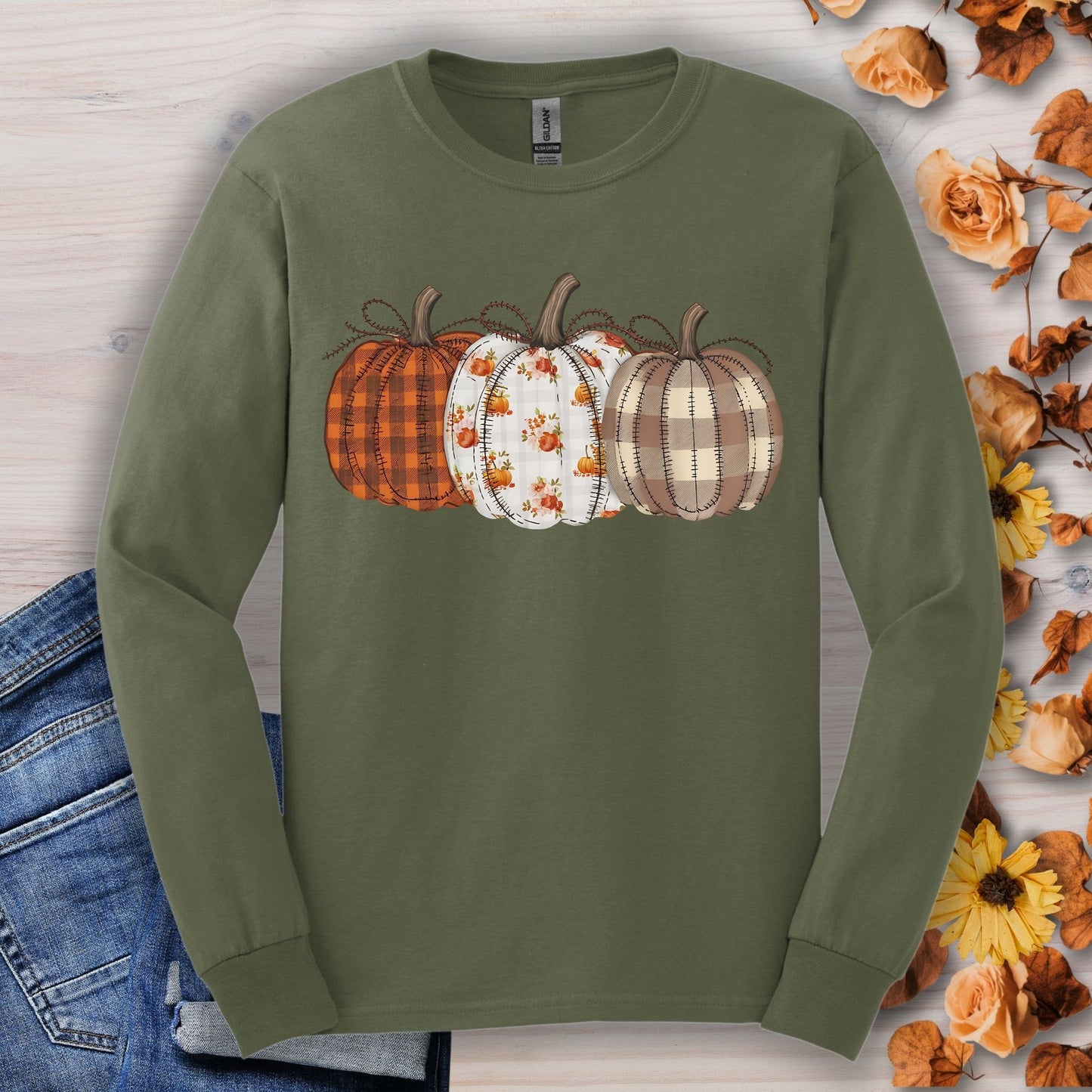 Military Green long sleeve tee with 3 quilted pumpkins: plaid, floral, and checkered designs.