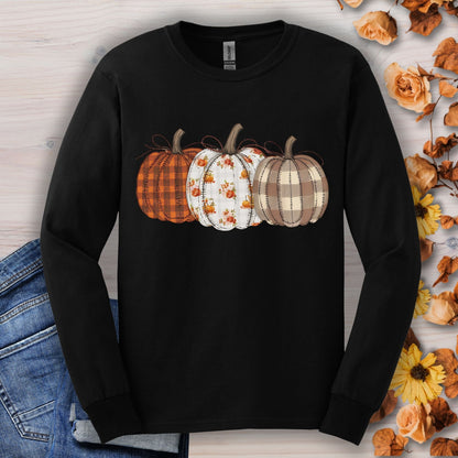 Black long sleeve tee with 3 quilted pumpkins: plaid, floral, and checkered designs.