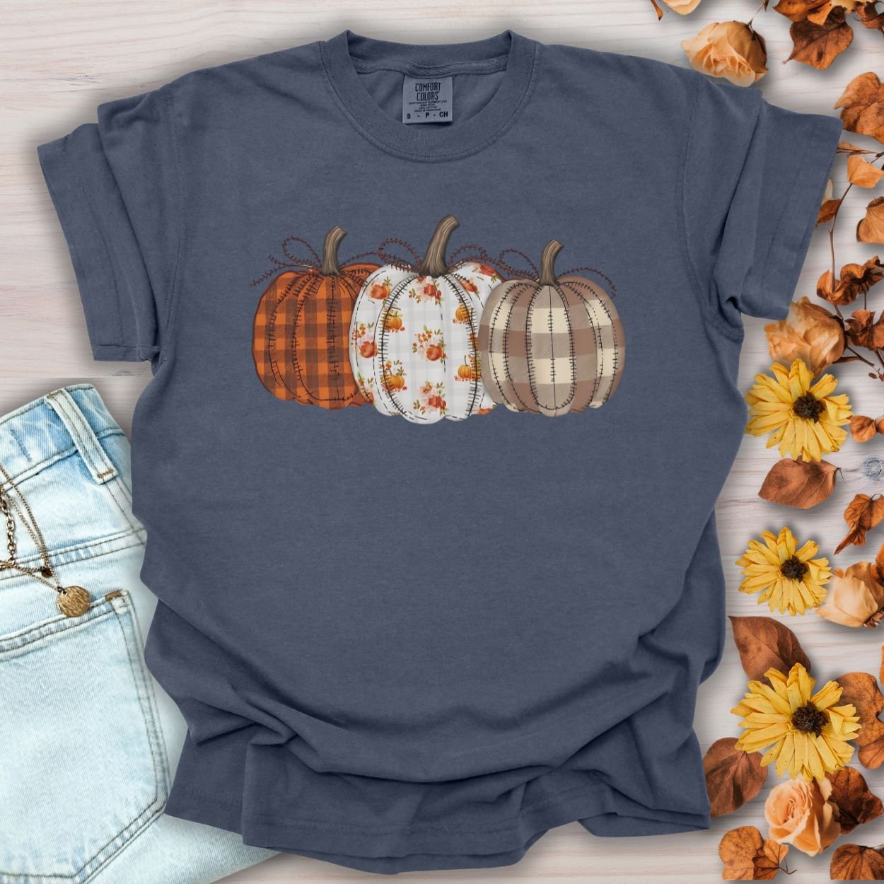 Denim Quilted Pumpkins T-Shirt with plaid, gingham, and leaf patterned pumpkins.