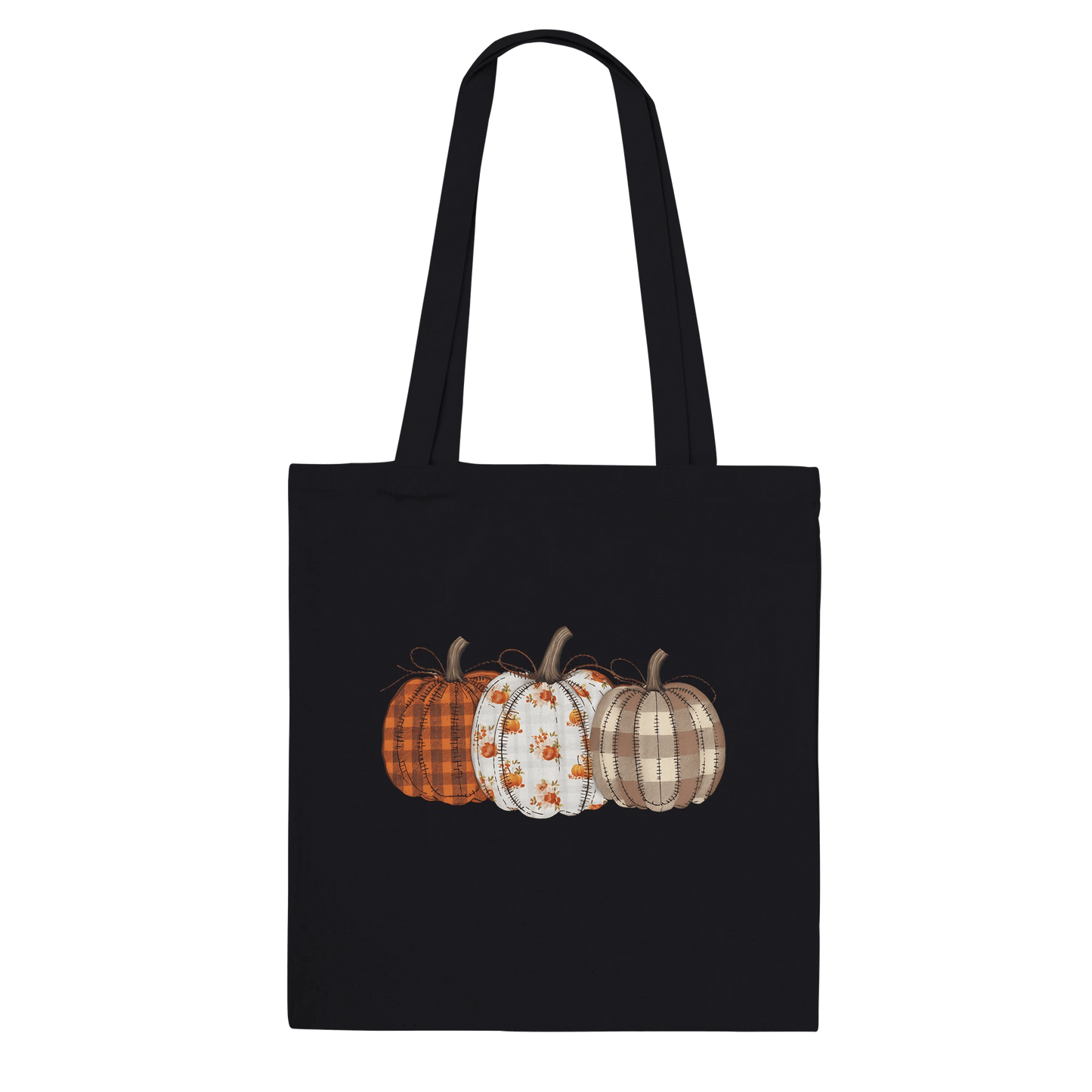 Black cotton tote bag with a quilted pumpkins design in orange, white, and beige plaid patterns.