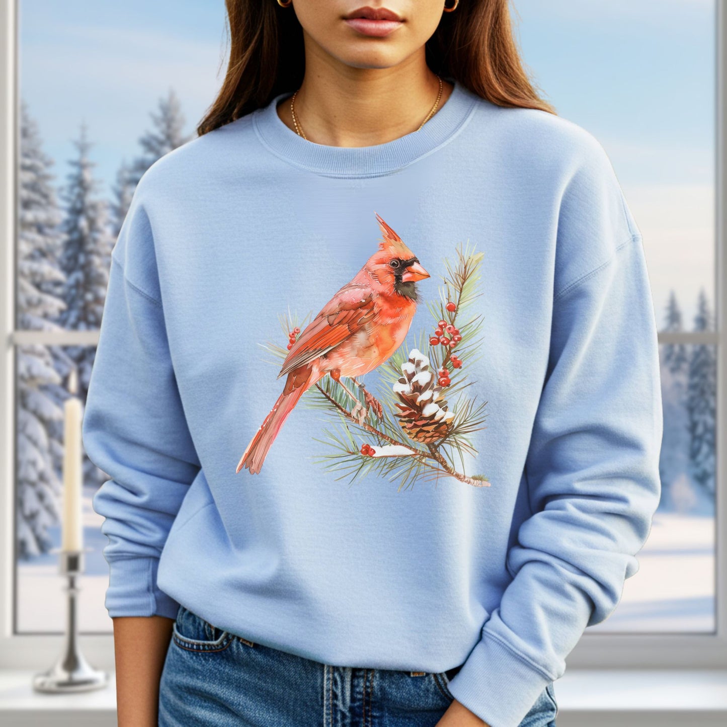 Light blue sweatshirt with a detailed red cardinal on a snowy evergreen branch design.