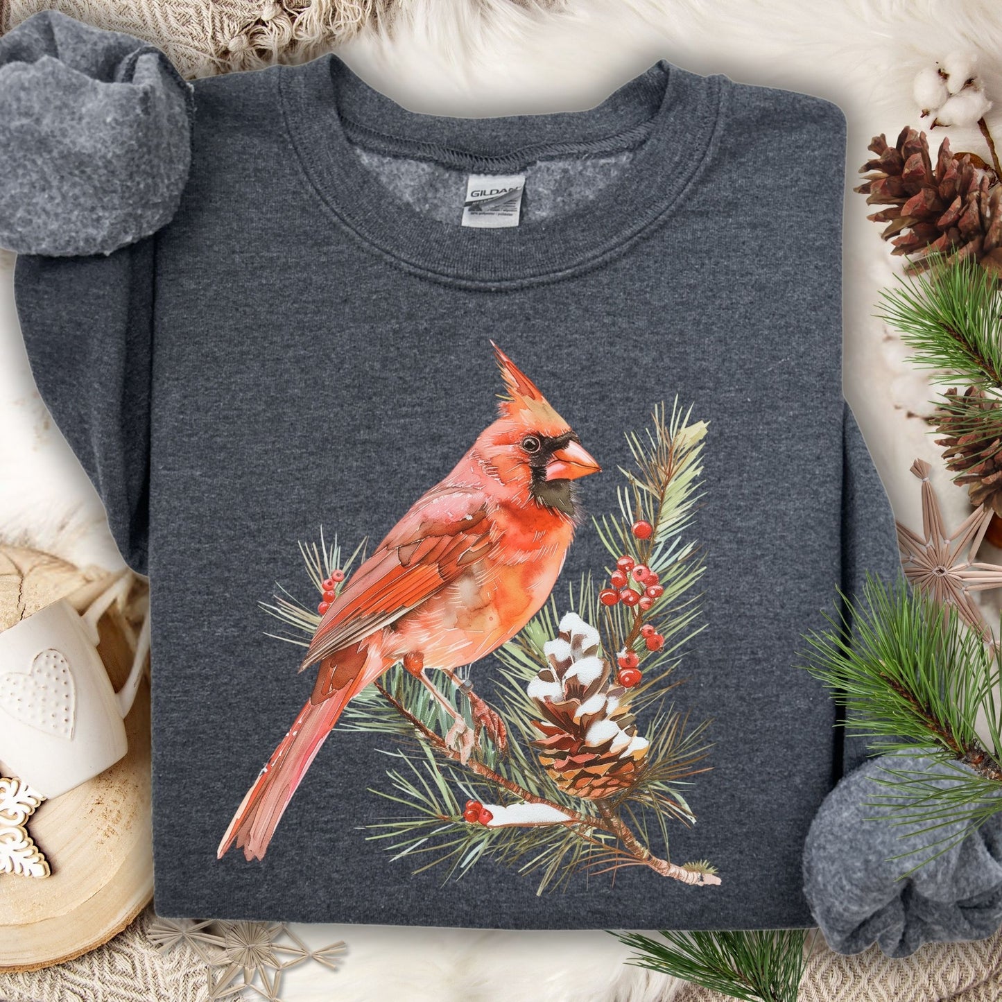 Dark Heather S sweatshirt with a red cardinal on a snowy evergreen branch design.