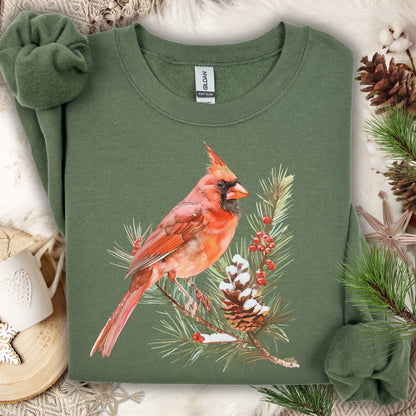 Military Green S sweatshirt with a red cardinal on a snowy evergreen branch design.