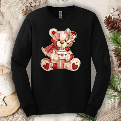 Black long-sleeve tee with a patchwork country teddy bear holding hot chocolate in beiges, reds, and pinks.