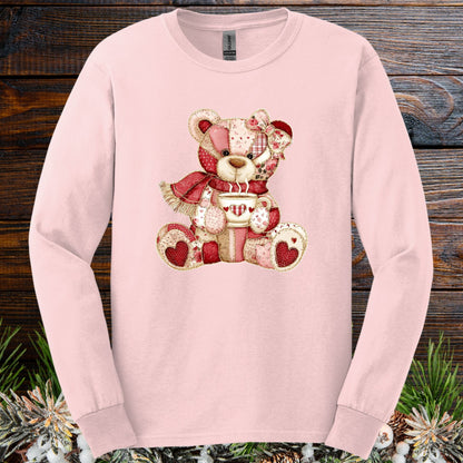 Light pink long-sleeve tee with a patchwork country teddy bear holding a hot chocolate mug.