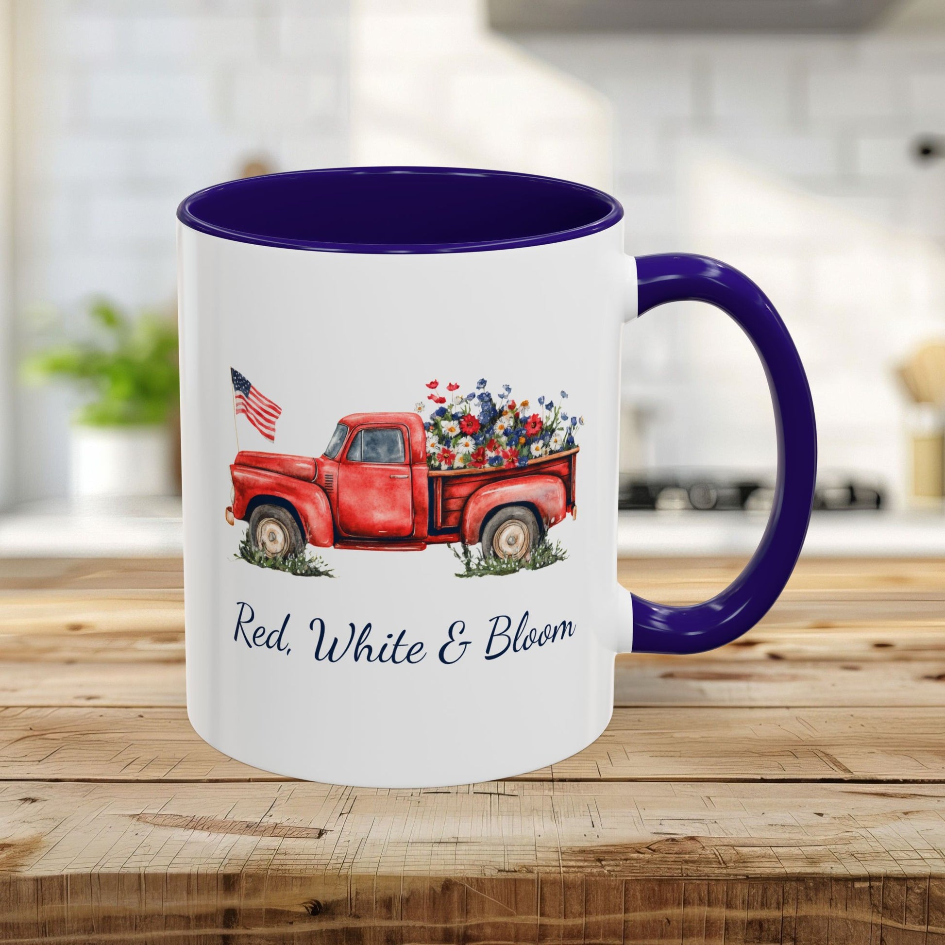 White 11oz ceramic mug with blue handle/interior, featuring a watercolor red truck with flowers and "Red, White & Bloom.