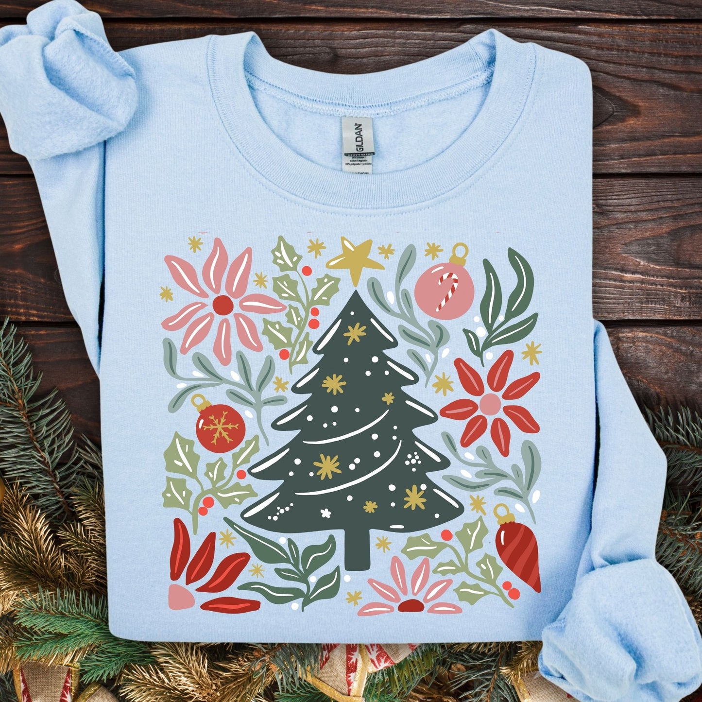 Light blue Gildan fleece sweatshirt with a colorful retro Christmas tree and floral design.