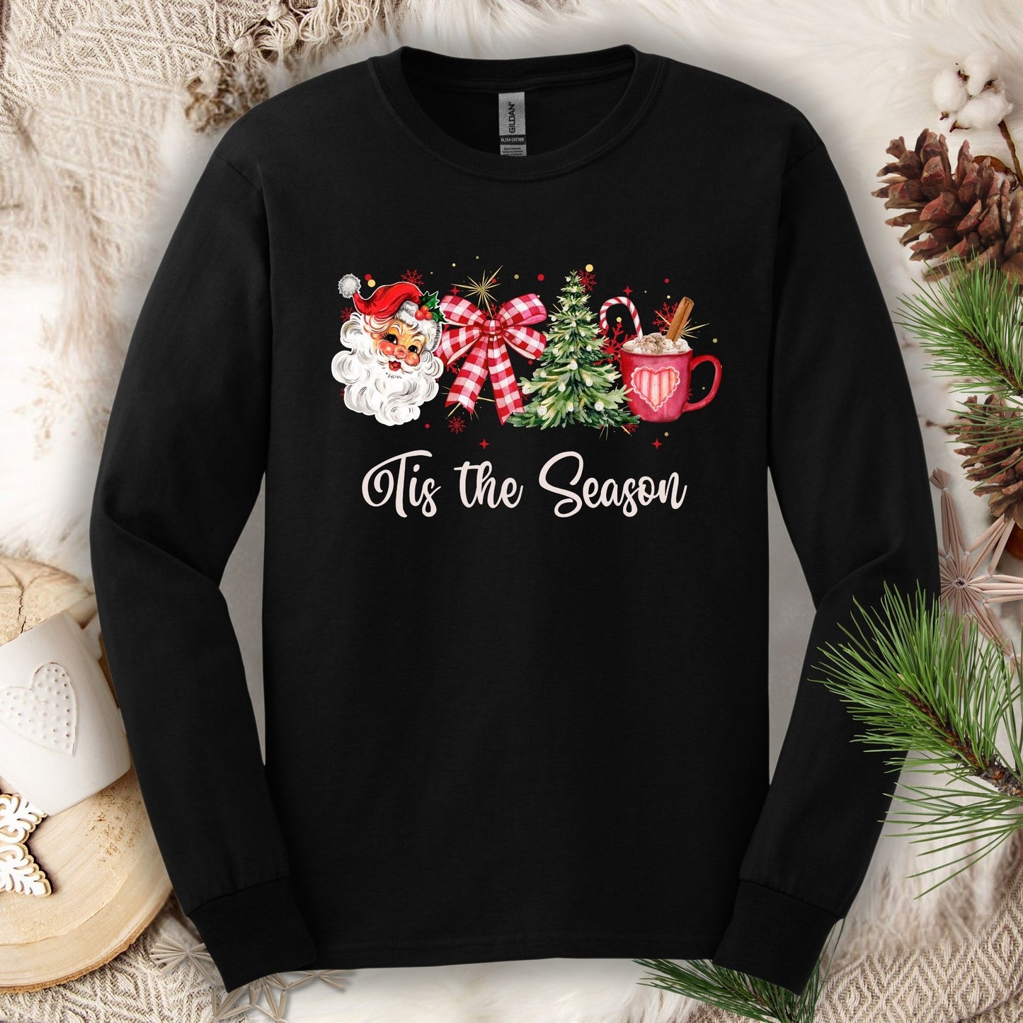 Black Gildan long sleeve tee with retro 1950s Santa, tree, red ribbon, cocoa, and "'Tis the Season" text.
