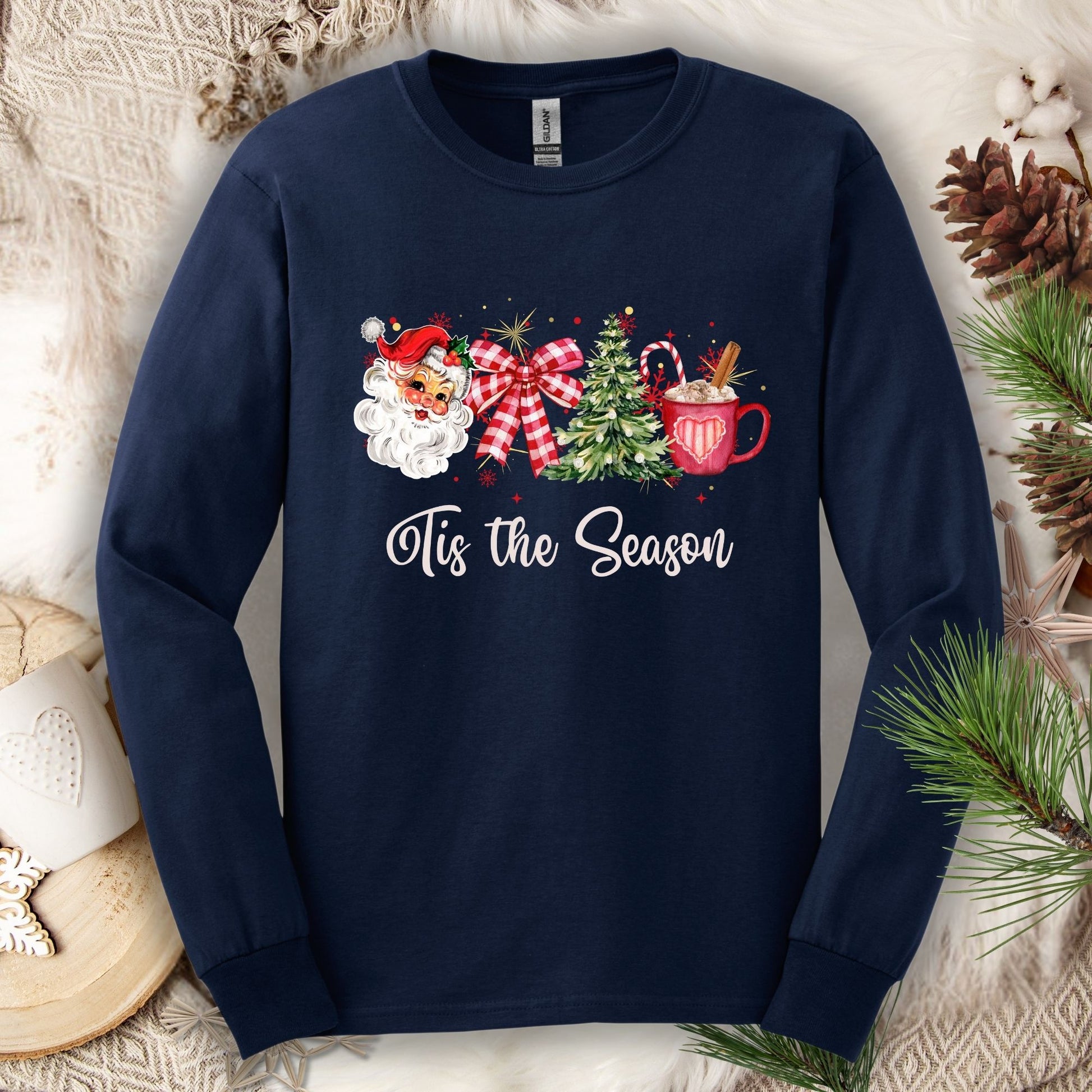 Navy long sleeve tee with retro 1950s Santa, Christmas tree, red plaid ribbon, and hot cocoa.