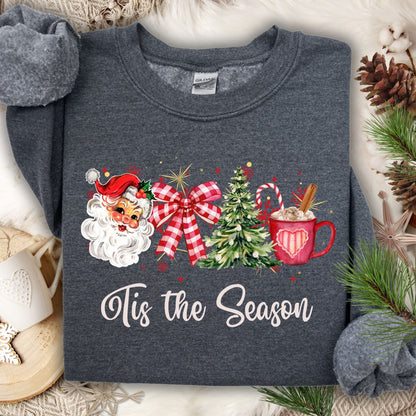Dark heather Gildan sweatshirt with retro 1950s Santa, red bow, Christmas tree, cocoa, and "Tis the Season" text.