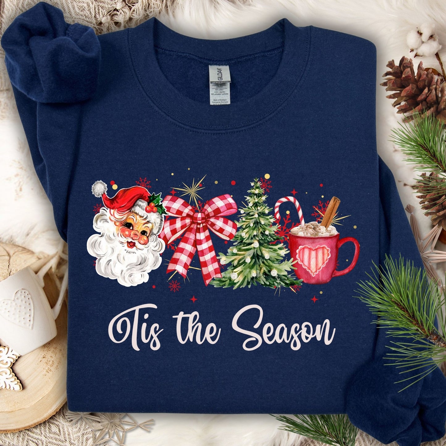 Navy Gildan sweatshirt with retro 1950s Santa, plaid bow, Christmas tree, hot cocoa, and "Tis the Season" text.