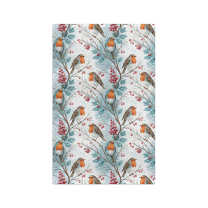 Microfiber tea towel with a watercolor pattern of robins on holly branches with red berries.