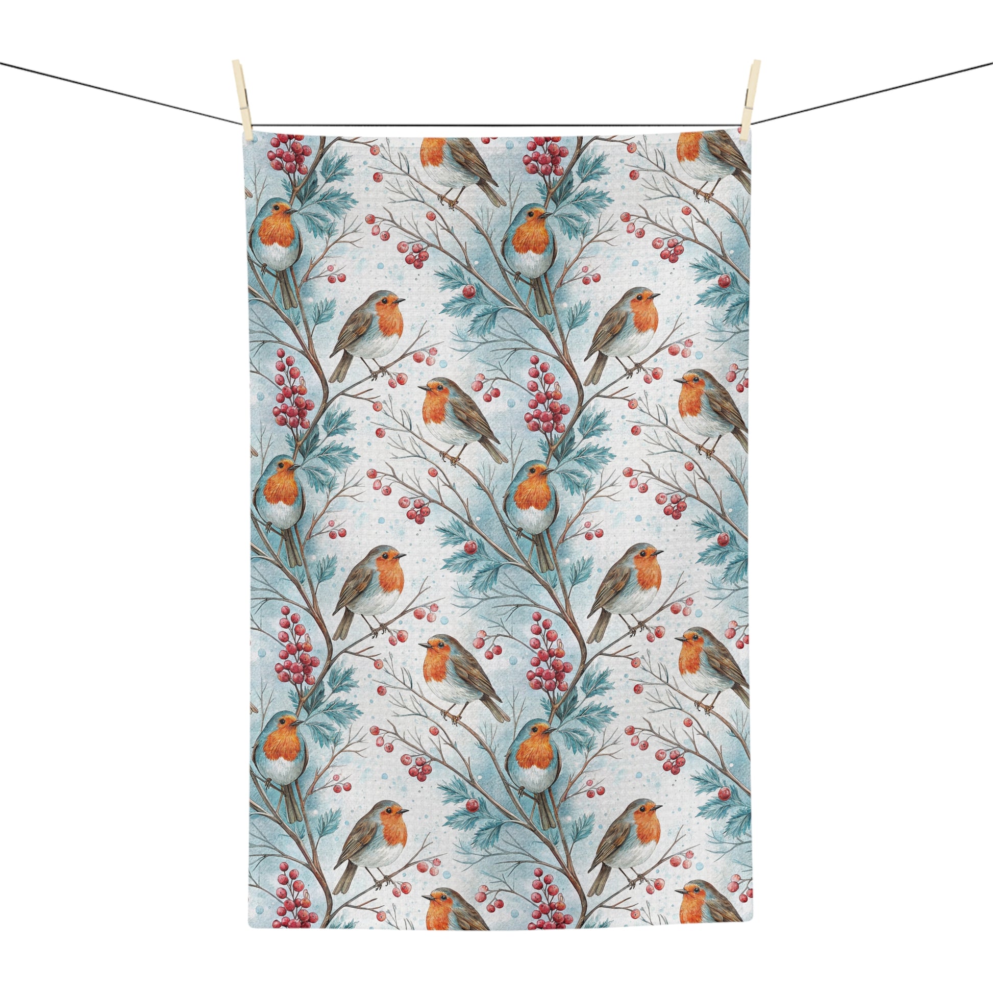 Microfiber tea towel with watercolor robins and red holly berries on blue-tinged branches.