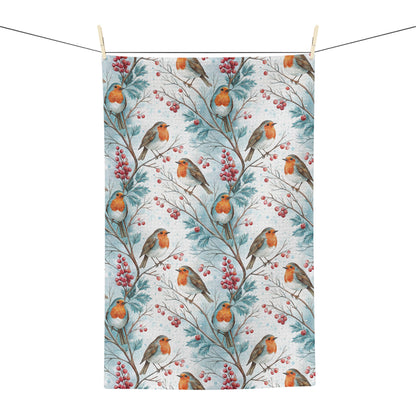 Microfiber tea towel with watercolor robins and red holly berries on blue-tinged branches.