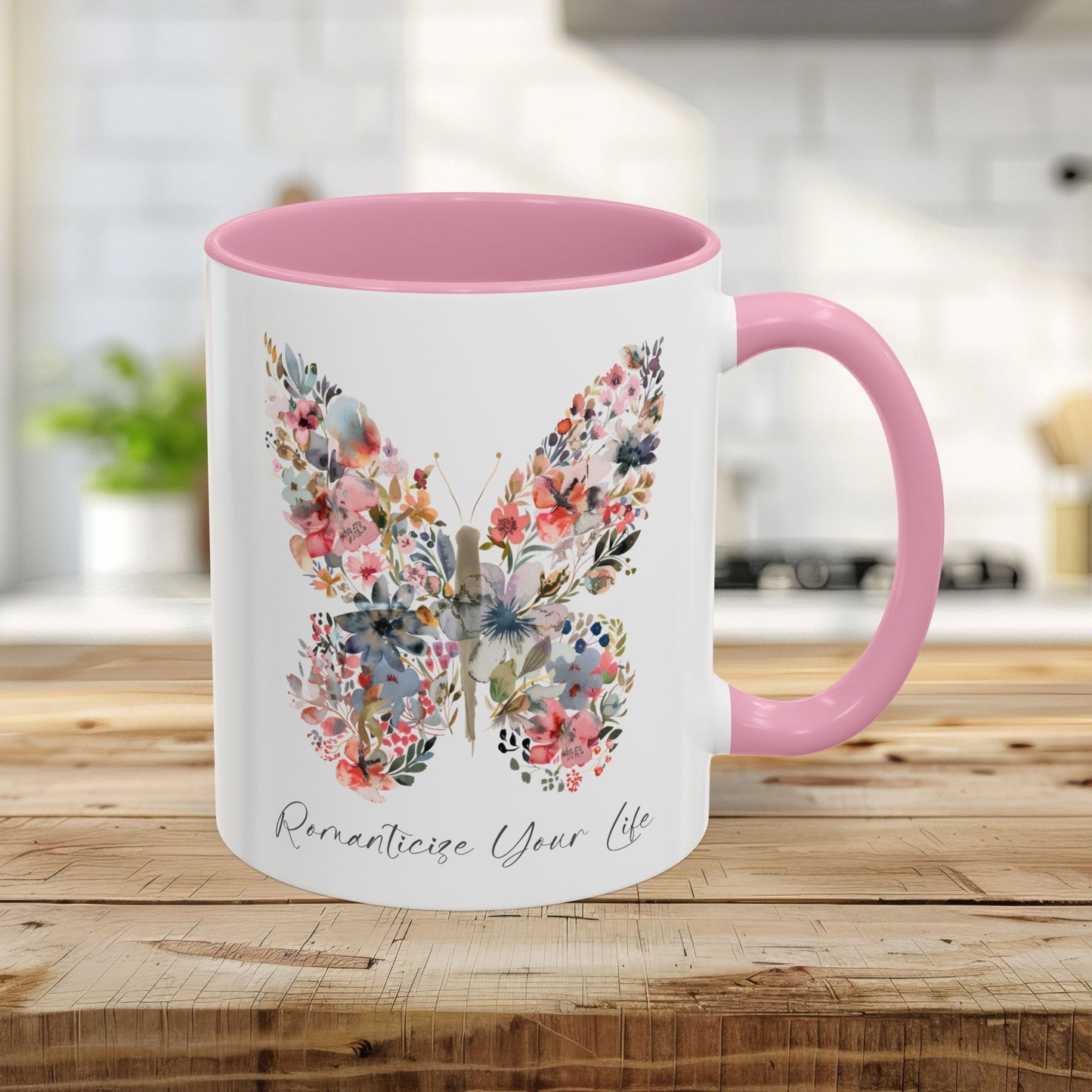 11oz white ceramic mug with a pink interior/handle and a watercolor floral butterfly design.