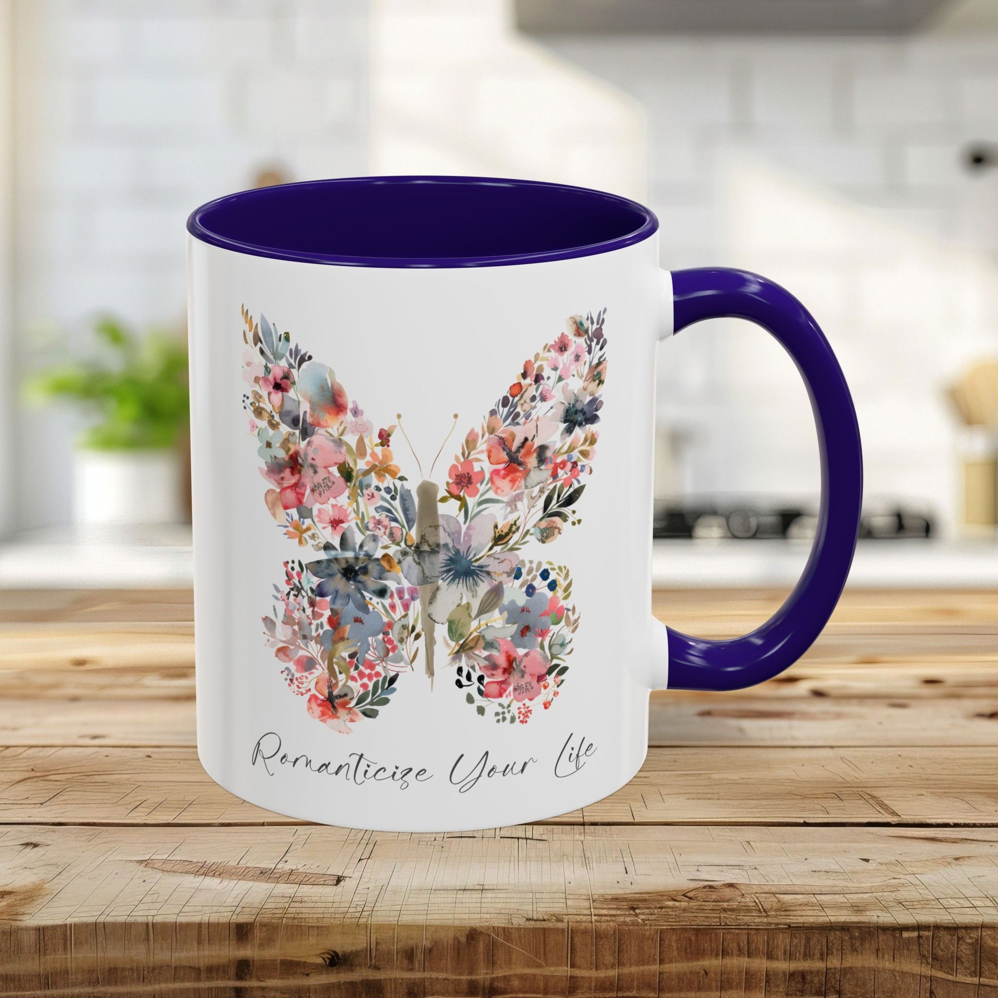 11oz white ceramic mug with blue interior/handle, featuring a watercolor floral butterfly and "Romanticize Your Life" text.