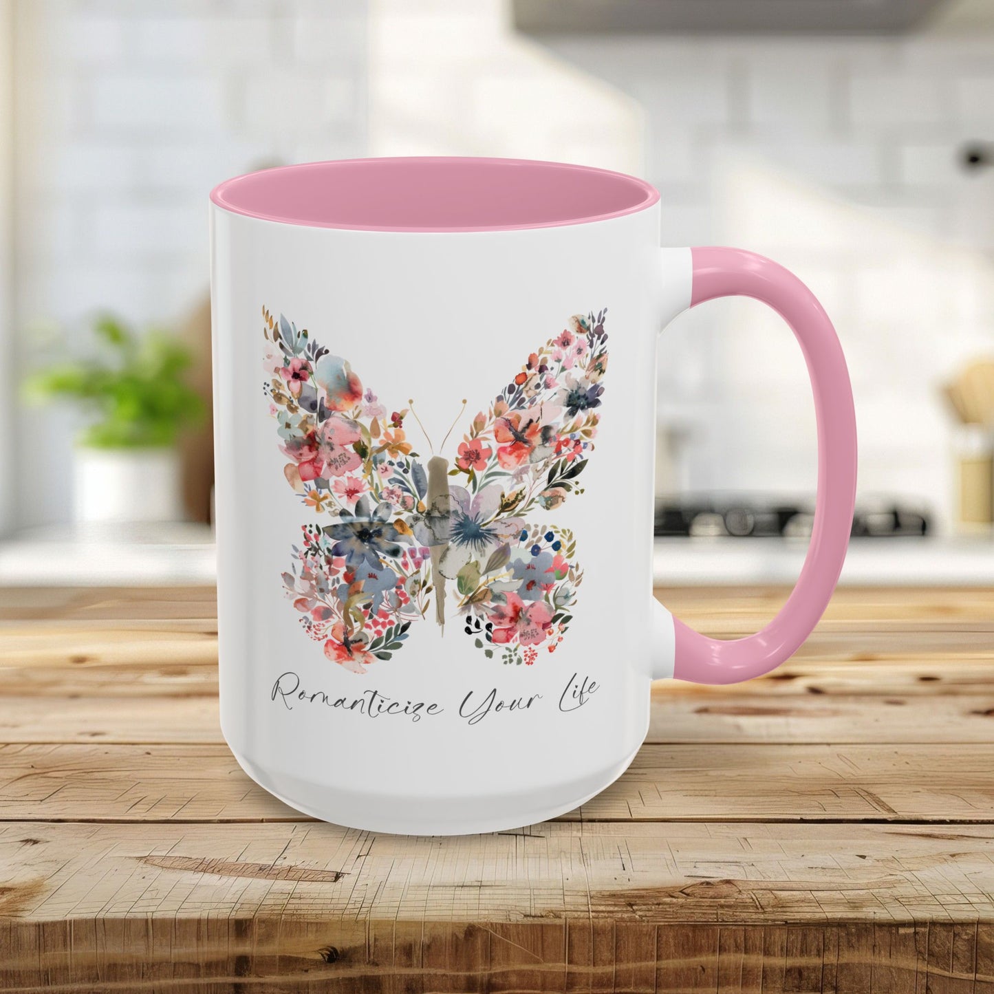 15oz glossy ceramic mug with a pink interior/handle, featuring a watercolor floral butterfly and "Romanticize Your Life" text.