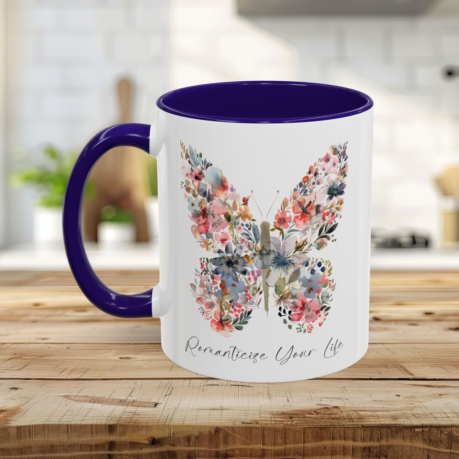 White ceramic mug with a watercolor floral butterfly, purple handle, and interior, "Romanticize Your Life" text.