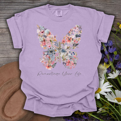 Orchid S-size garment-dyed cotton t-shirt with a floral butterfly design and "Romanticize Your Life" text.