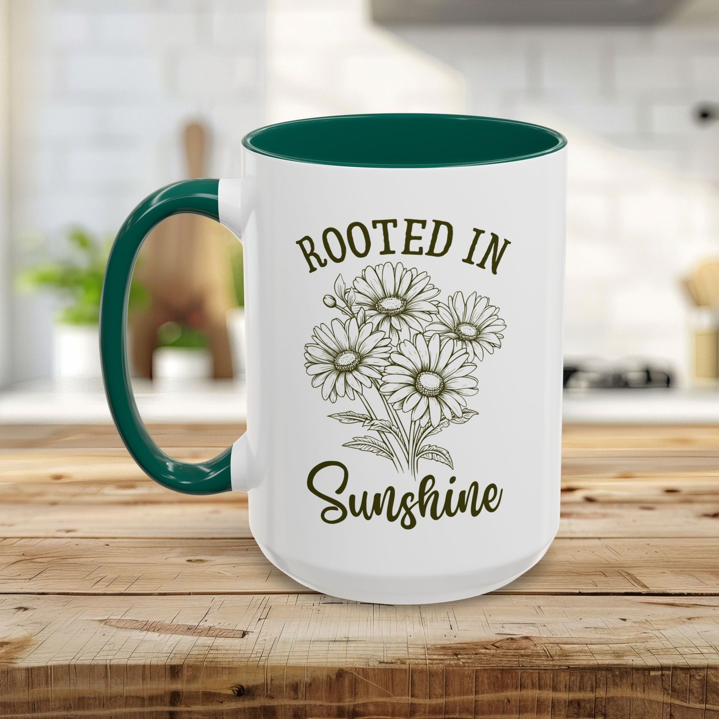 White ceramic mug with green interior and handle, featuring "Rooted in Sunshine" and hand-drawn daisies.