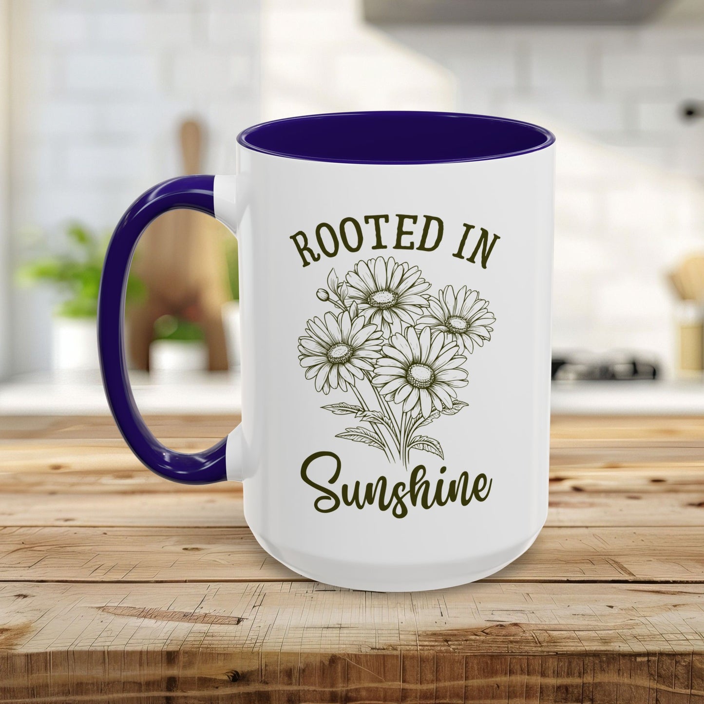 White ceramic mug with purple interior and handle, featuring "Rooted in Sunshine" text and hand-drawn daisies.