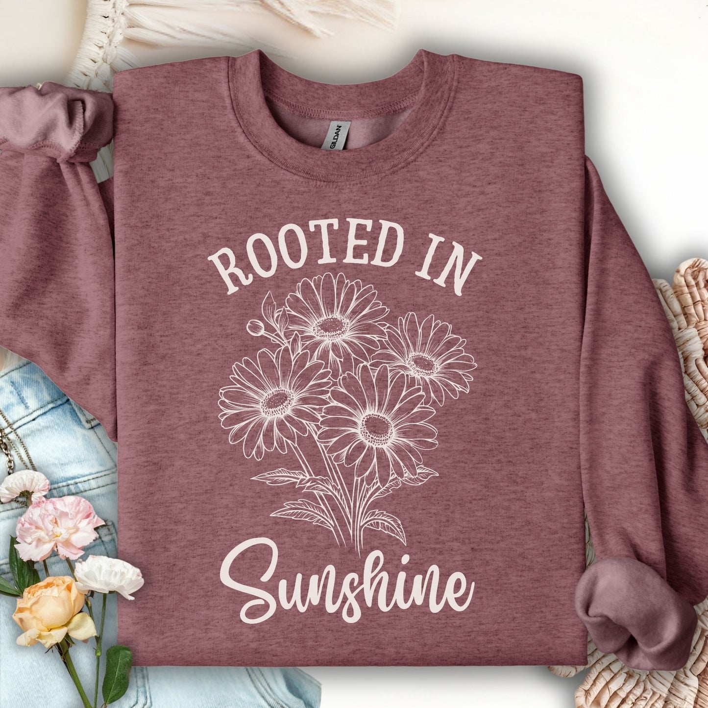 Heather Sport Dark Maroon daisy sweatshirt with "Rooted in Sunshine" graphic, cotton-polyester blend.